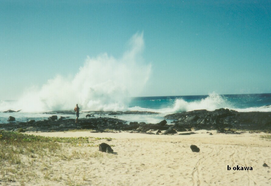 waves crashing at a sandy beach